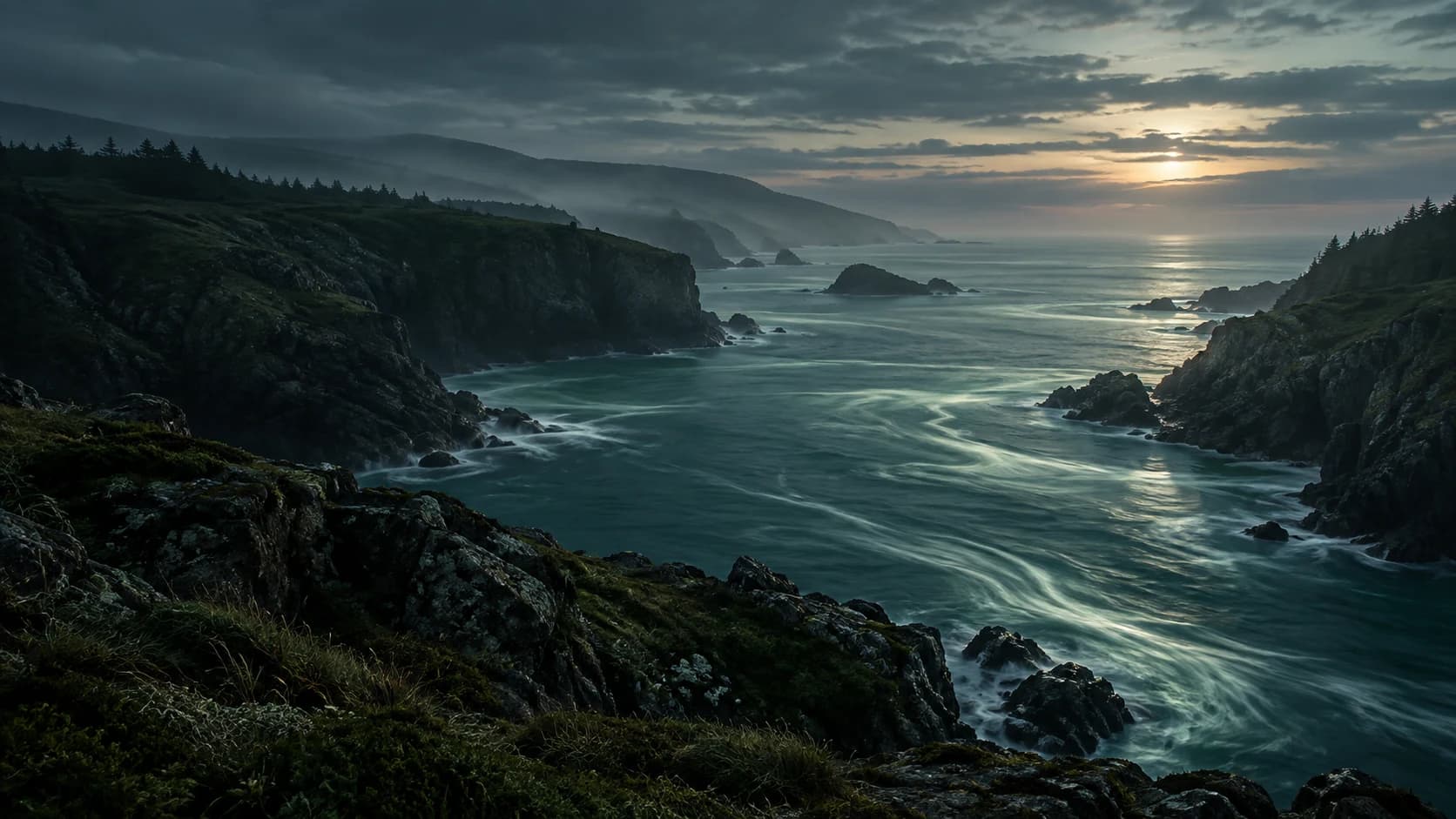 A northern coastline with silver-green reflections on dark water.